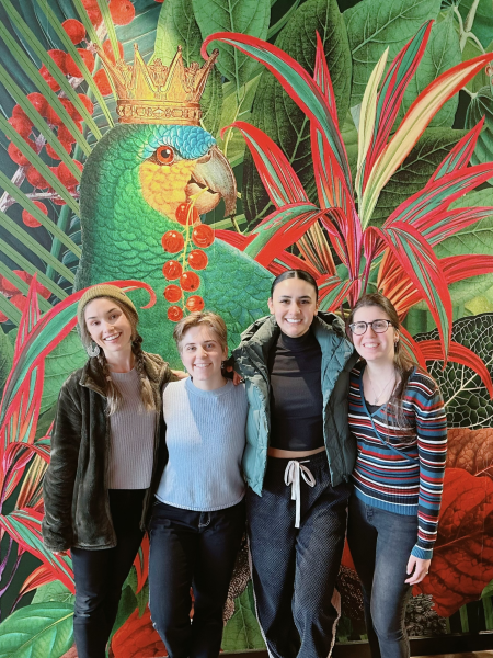 Shyanne, Kelley, Jess, and Yasemin in front of colorful mural.