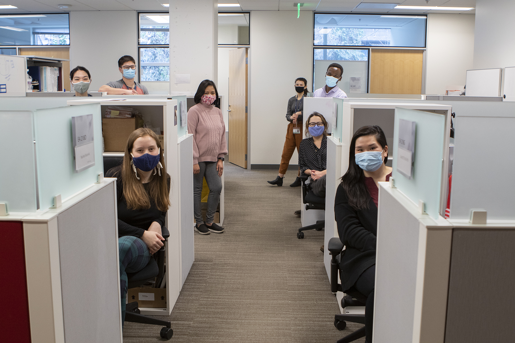 Boeckh group clinical unit team members stand by their cubicles