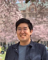 A photo of Ren at UW cherry blossoms