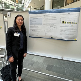 Yibai Zhao with poster