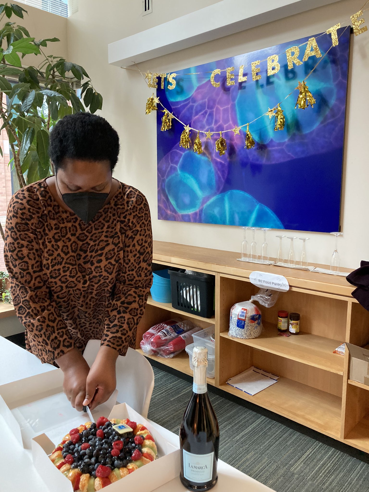 Jodiene cutting a cake