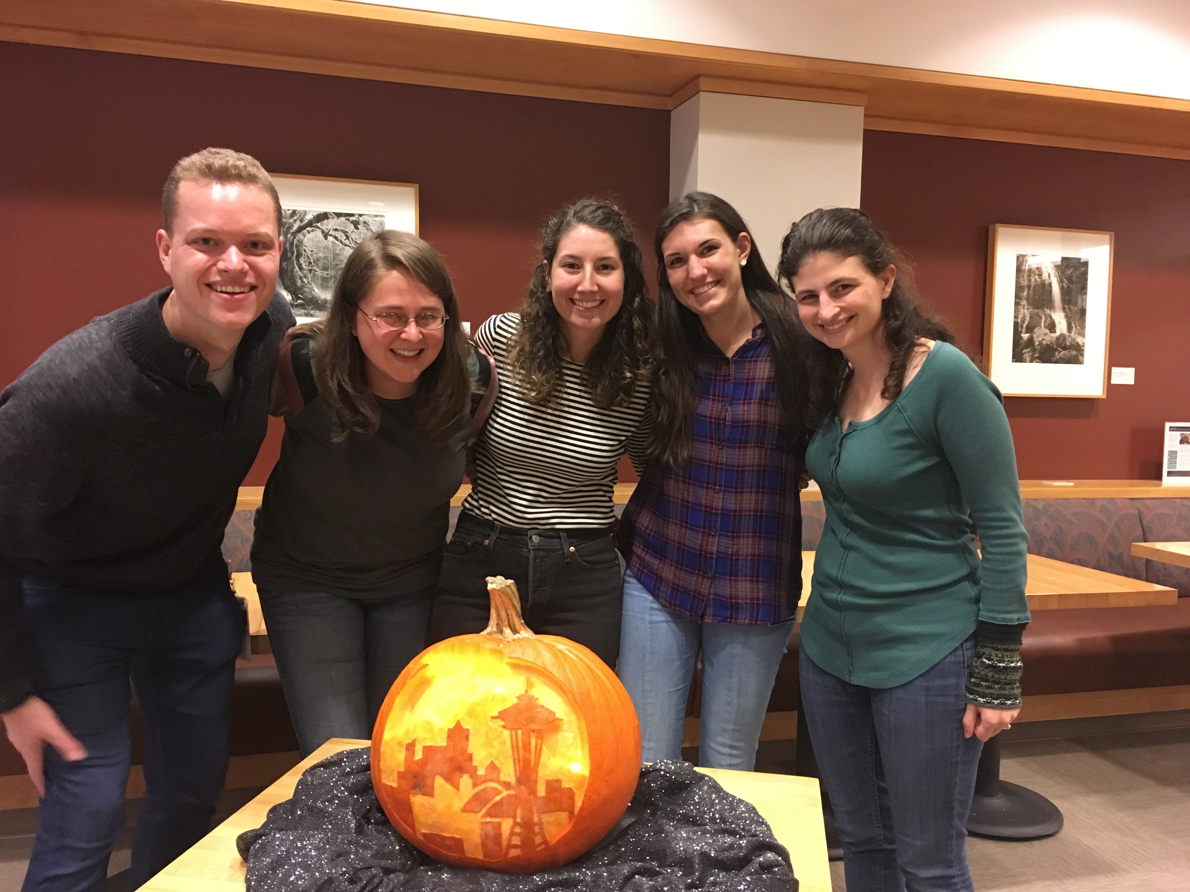 Group posing with pumpkin